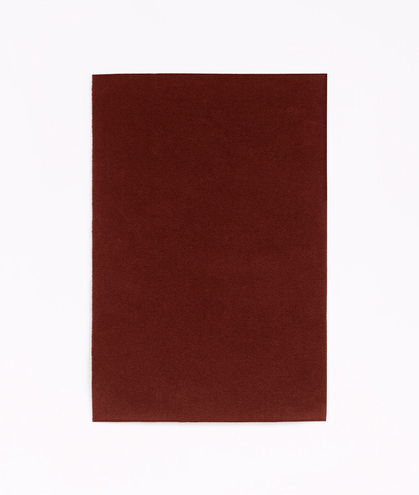 Deep burgundy red velvet swatch showing a plain, softly directional pile