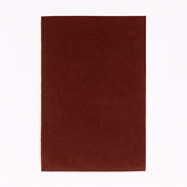 Deep burgundy red velvet swatch showing a plain, softly directional pile