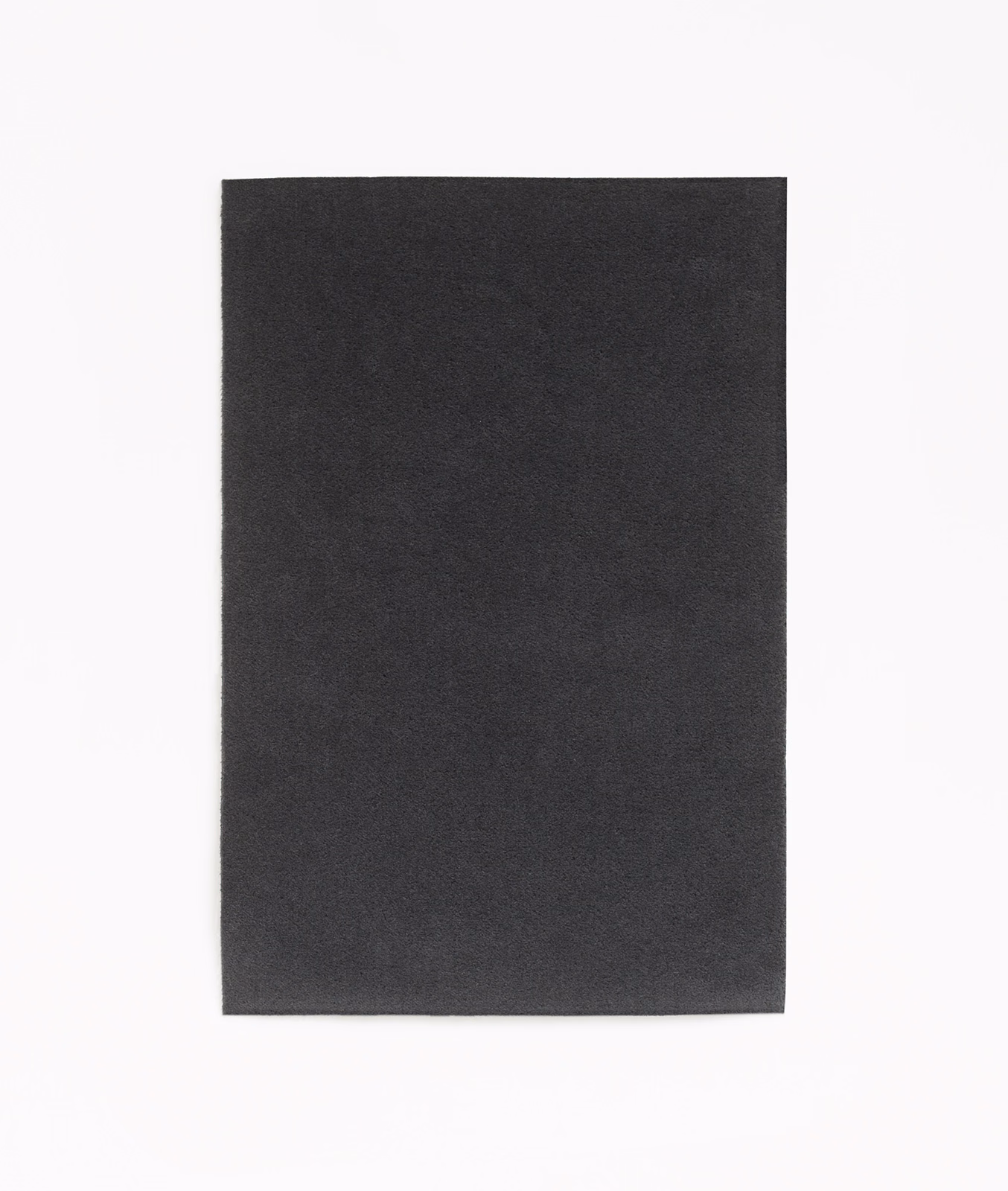Deep anthracite velvet swatch showing a soft, subtly varied plain pile