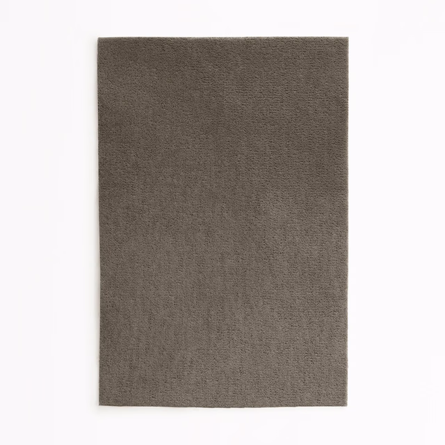 Deep brown-taupe plain velvet swatch showing a softly directional short nap