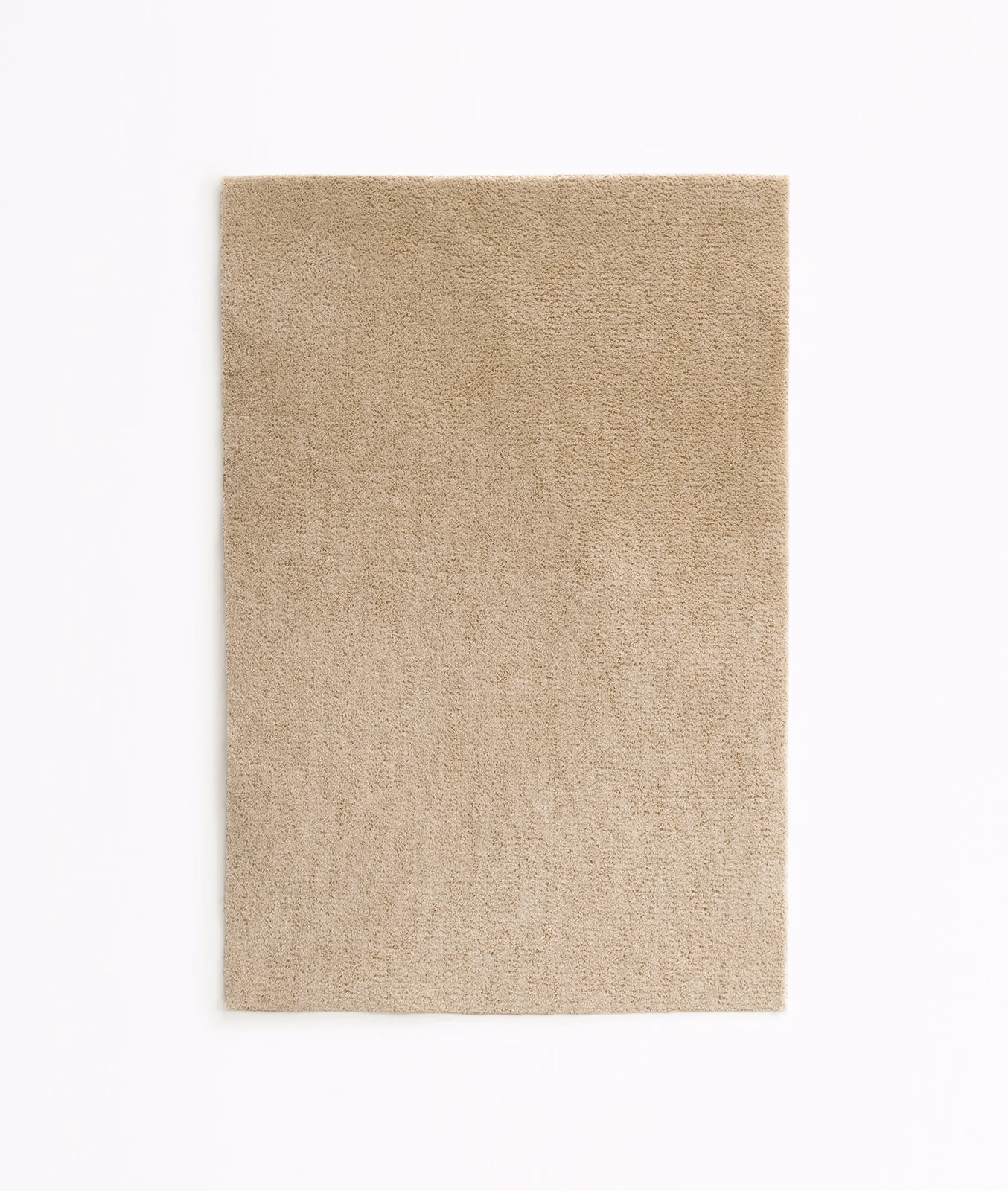 Warm oatmeal beige velvet swatch showing a fine, softly varied plain pile