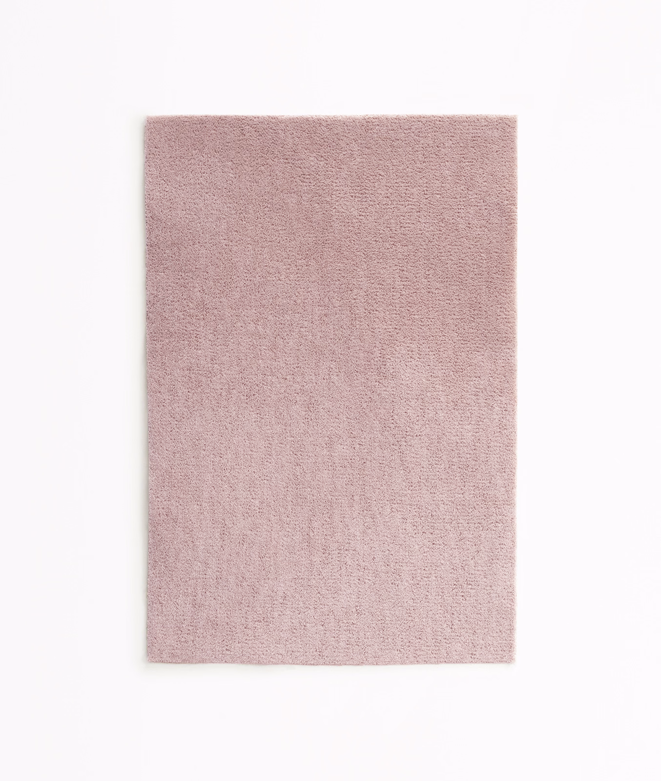 Dusty blush-pink velvet swatch showing a fine, softly varied pile