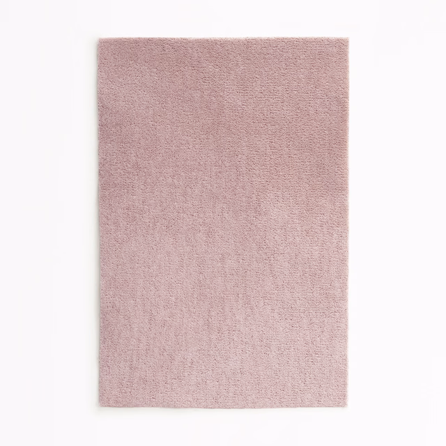 Dusty blush-pink velvet swatch showing a fine, softly varied pile