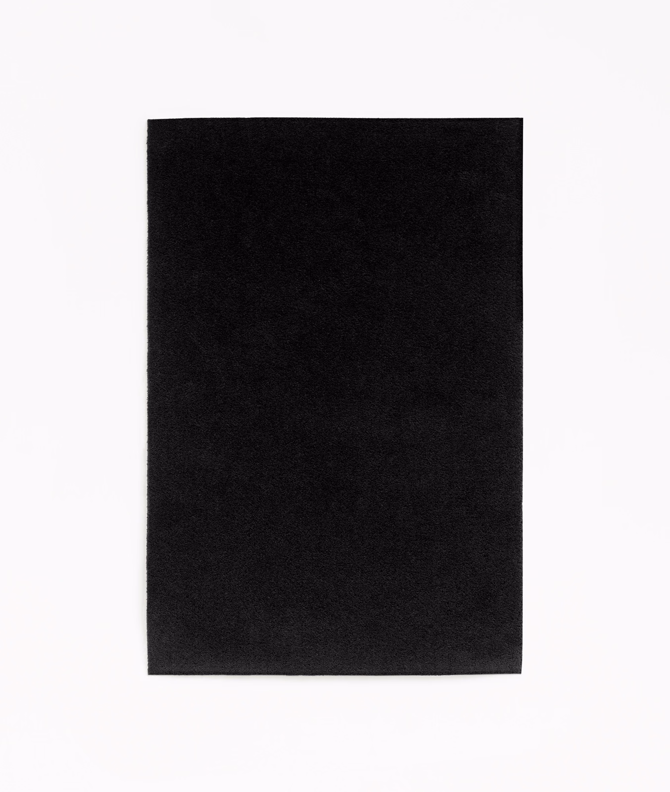 Deep black velvet swatch with subtle directional nap and a soft, restrained sheen