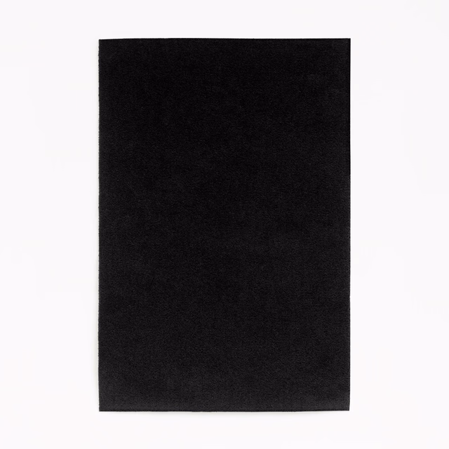 Deep black velvet swatch with subtle directional nap and a soft, restrained sheen