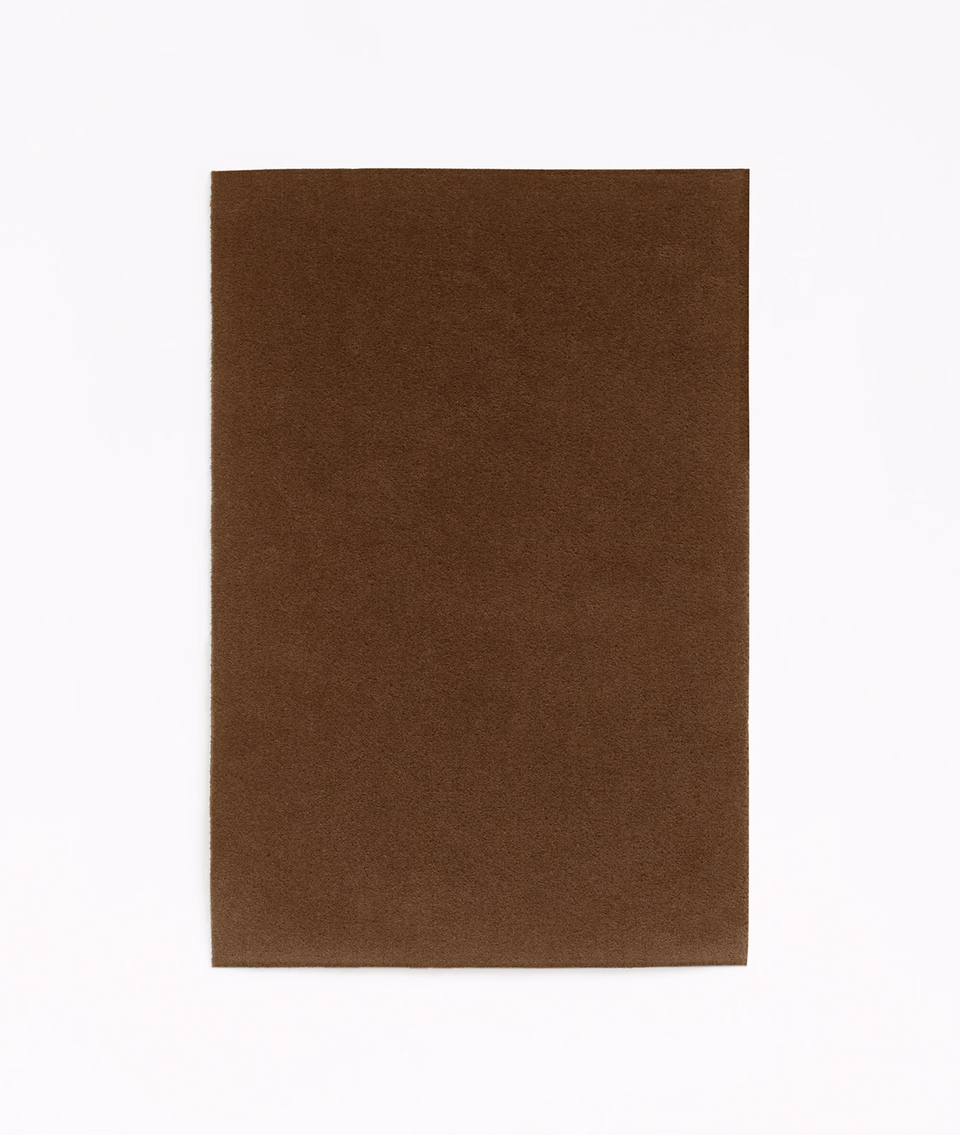 Warm tobacco-brown velvet with subtle nap shading across a plain surface