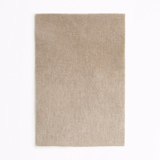 Warm mushroom-taupe velvet swatch with a fine, softly textured plain pile