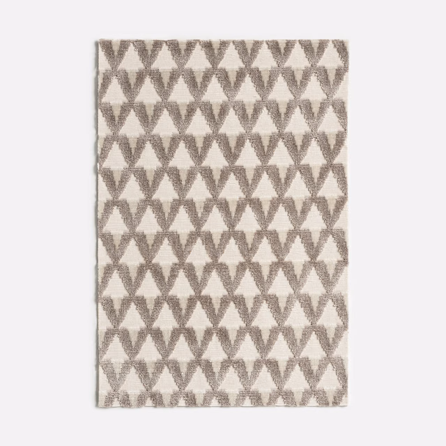 Alabaster velvet with repeating soft taupe hourglass motifs and subtle surface depth