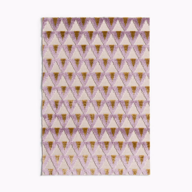 Amethyst velvet swatch with cream, plum and olive triangular geometric repeat