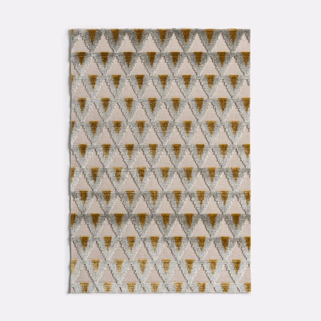 Ivory velvet with repeating ochre and taupe geometric diamond motifs