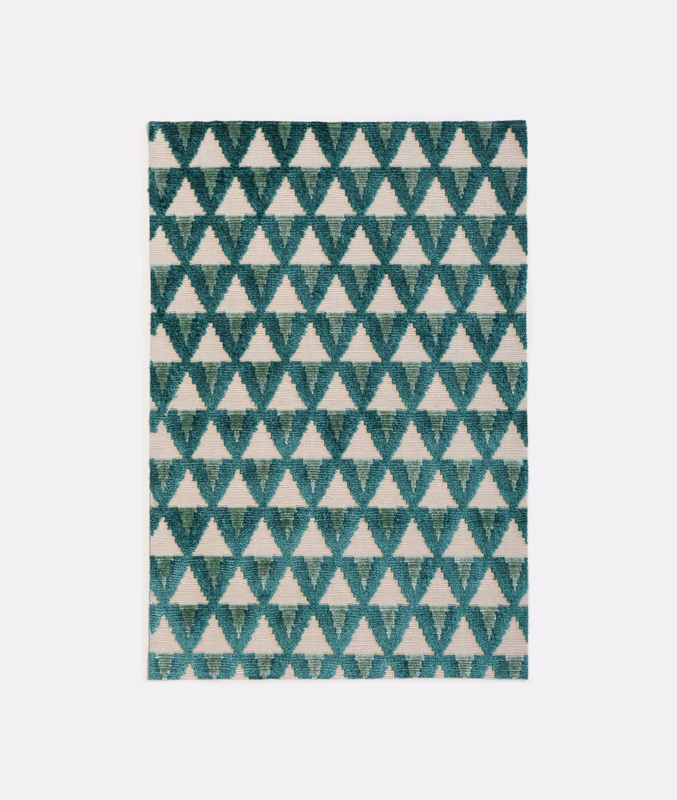 Deep malachite teal velvet with repeating cream triangles and a softly brushed surface