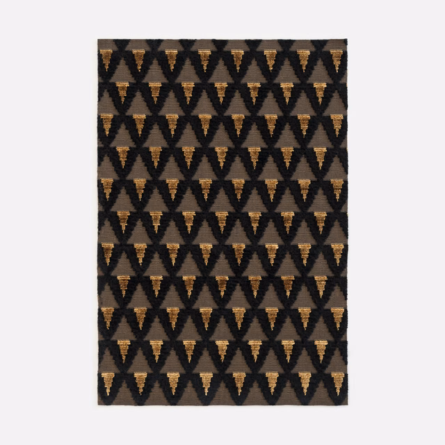 Charcoal velvet with repeating warm ochre downward-pointing triangles in neat rows