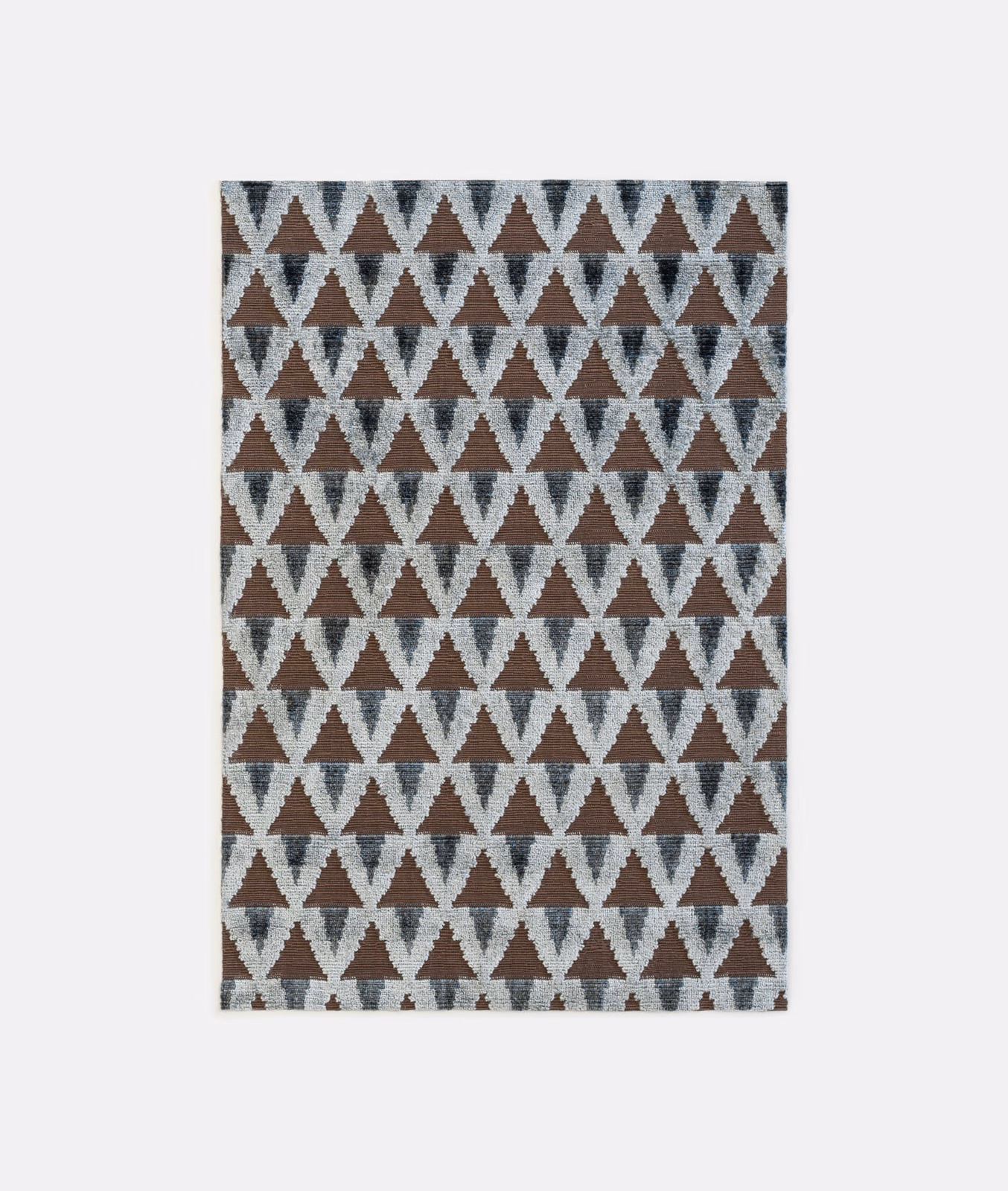 Charcoal velvet with pale grey and brown repeating triangular geometric pattern
