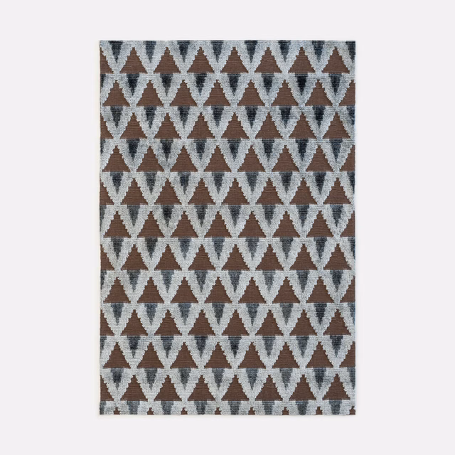 Charcoal velvet with pale grey and brown repeating triangular geometric pattern