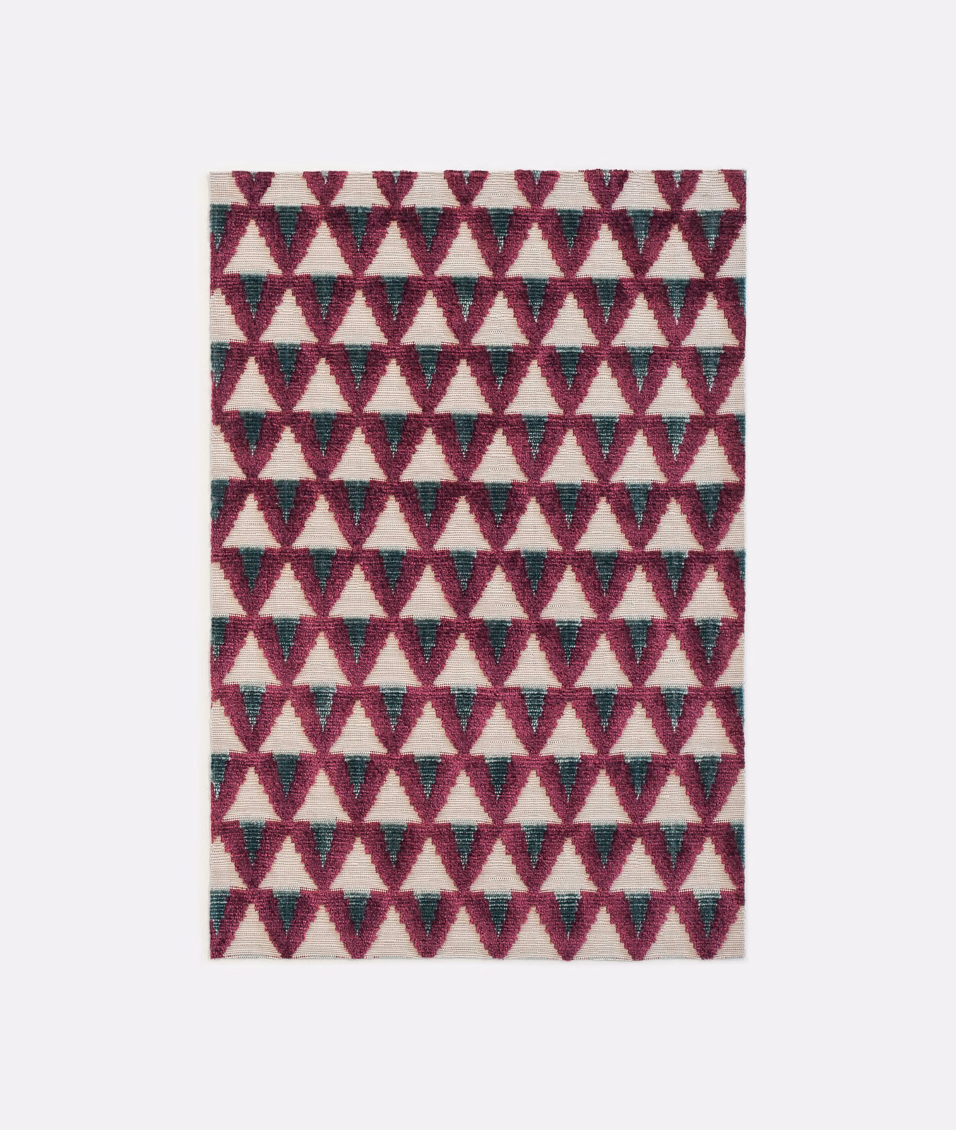 Burgundy and teal geometric triangles repeat across a plush cream velvet swatch