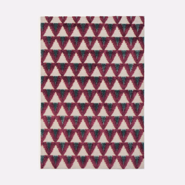 Burgundy and teal geometric triangles repeat across a plush cream velvet swatch