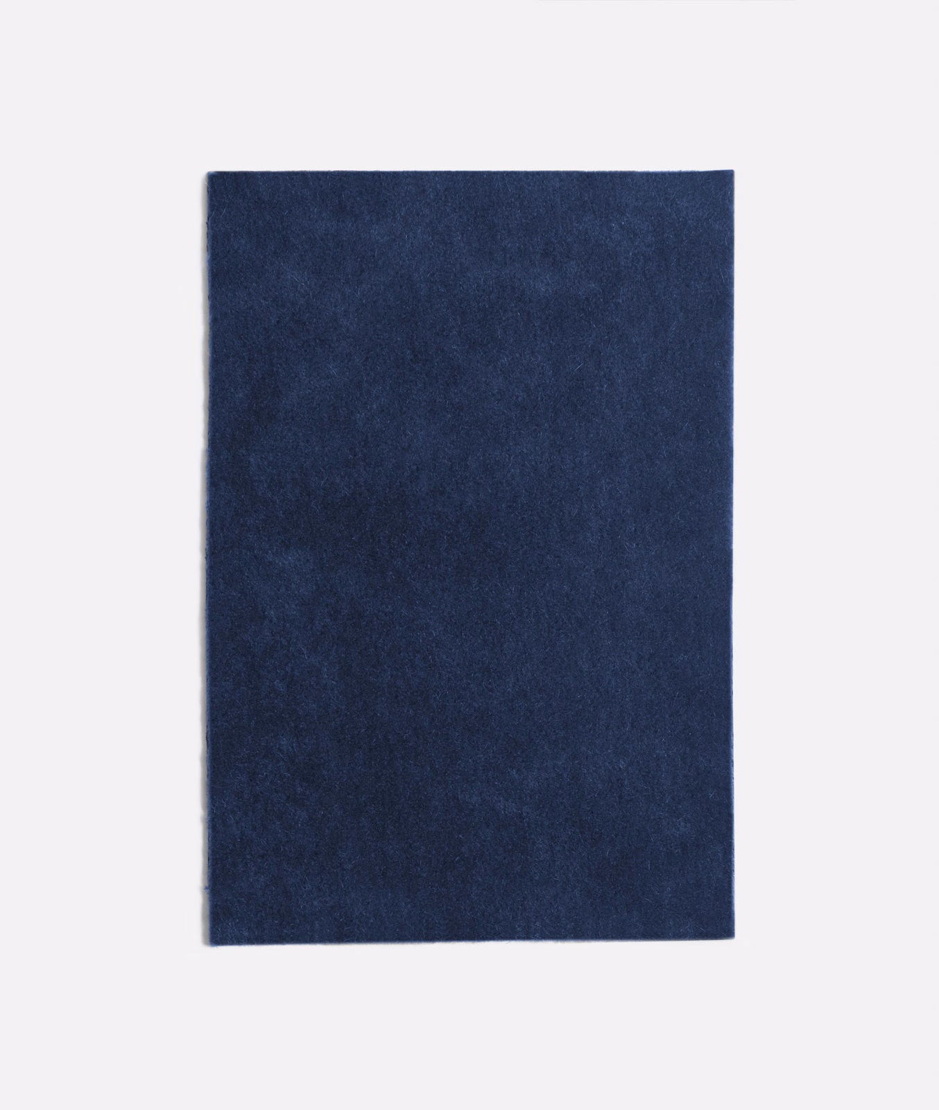 Deep Prussian blue velvet with a softly mottled nap and light-catching surface