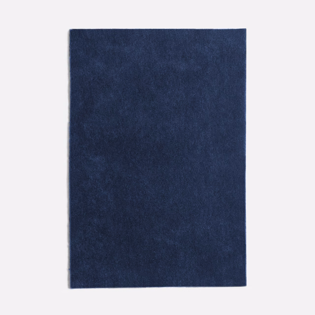 Deep Prussian blue velvet with a softly mottled nap and light-catching surface