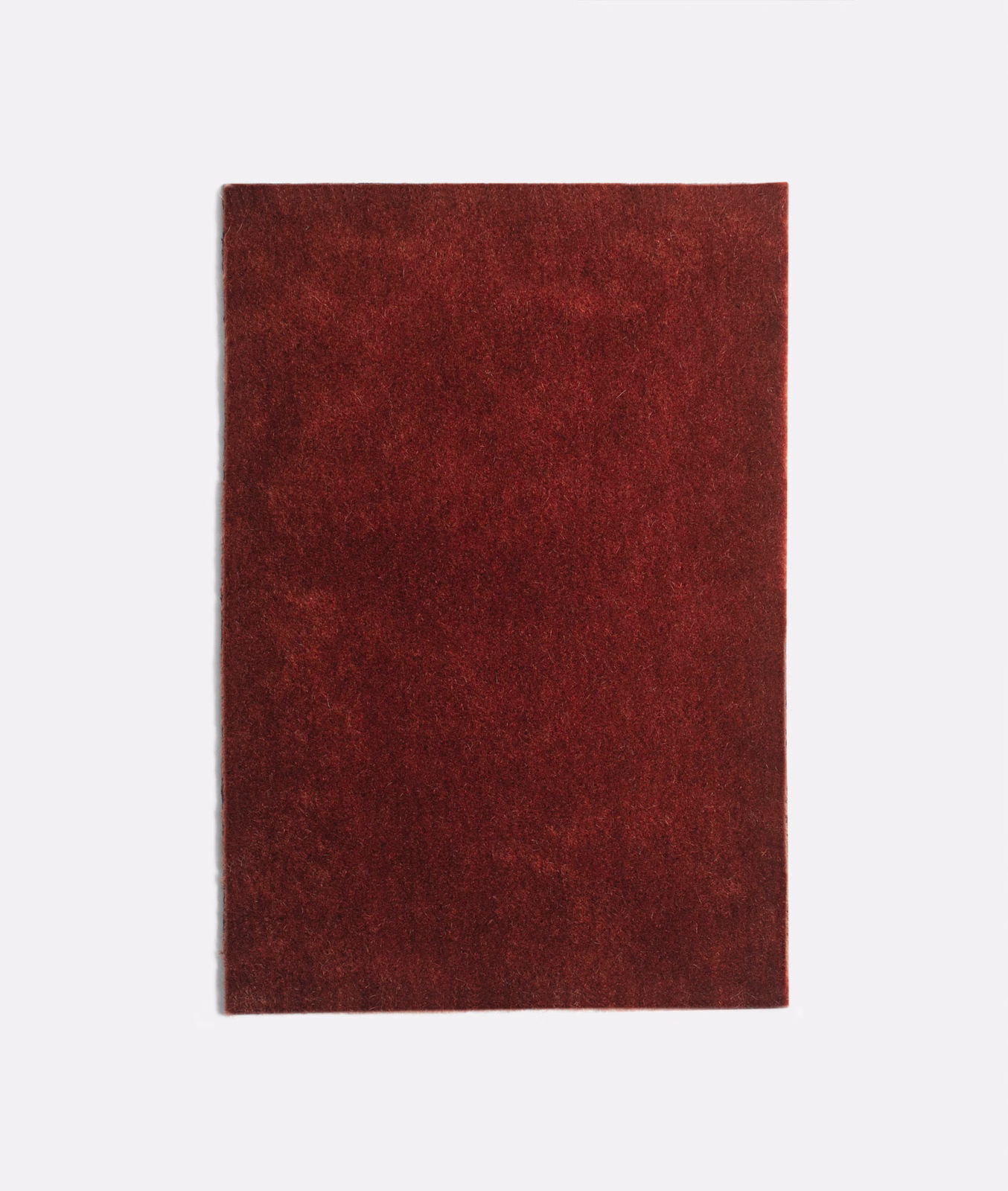 Deep Bordeaux-red velvet swatch with a softly mottled, shadowed pile