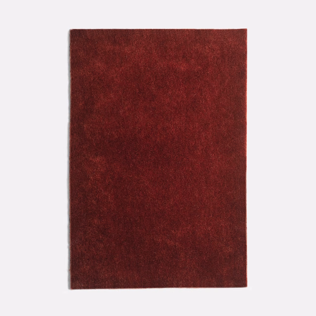 Deep Bordeaux-red velvet swatch with a softly mottled, shadowed pile