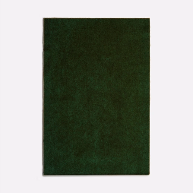 Deep bottiglia green velvet with softly mottled nap and subtle light-catching sheen