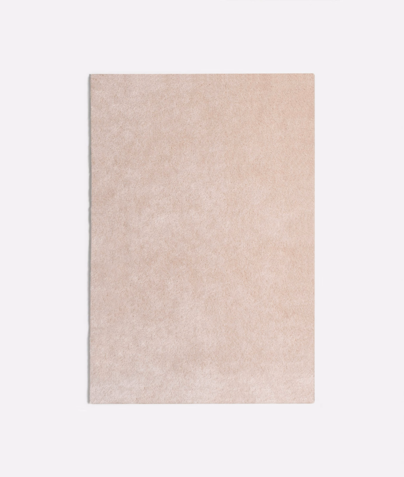 Pale blush-pink velvet swatch with softly mottled, powdery texture