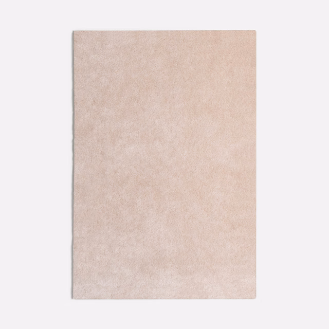 Pale blush-pink velvet swatch with softly mottled, powdery texture