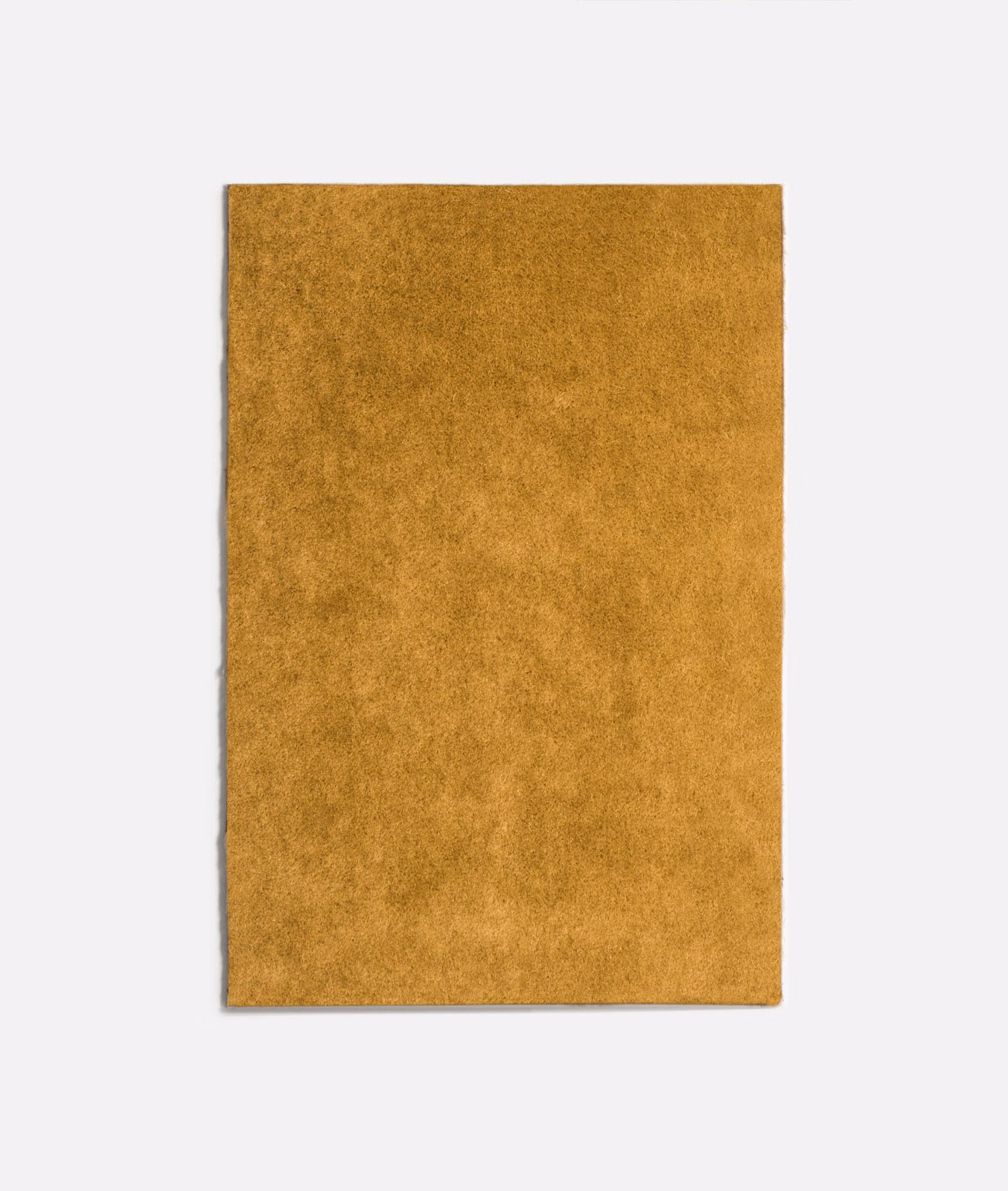 Curry-gold velvet swatch with softly mottled plush pile and warm tonal depth