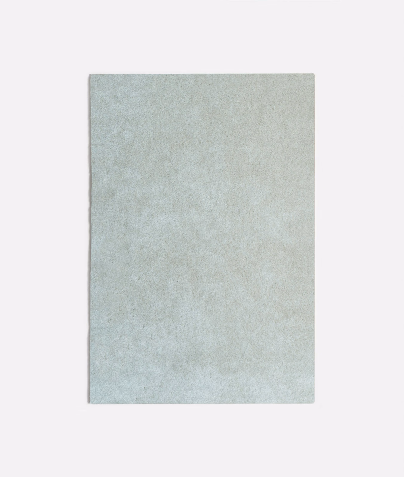 Pale ice-blue velvet swatch with softly mottled, frosted nap and subtle blue-grey shading