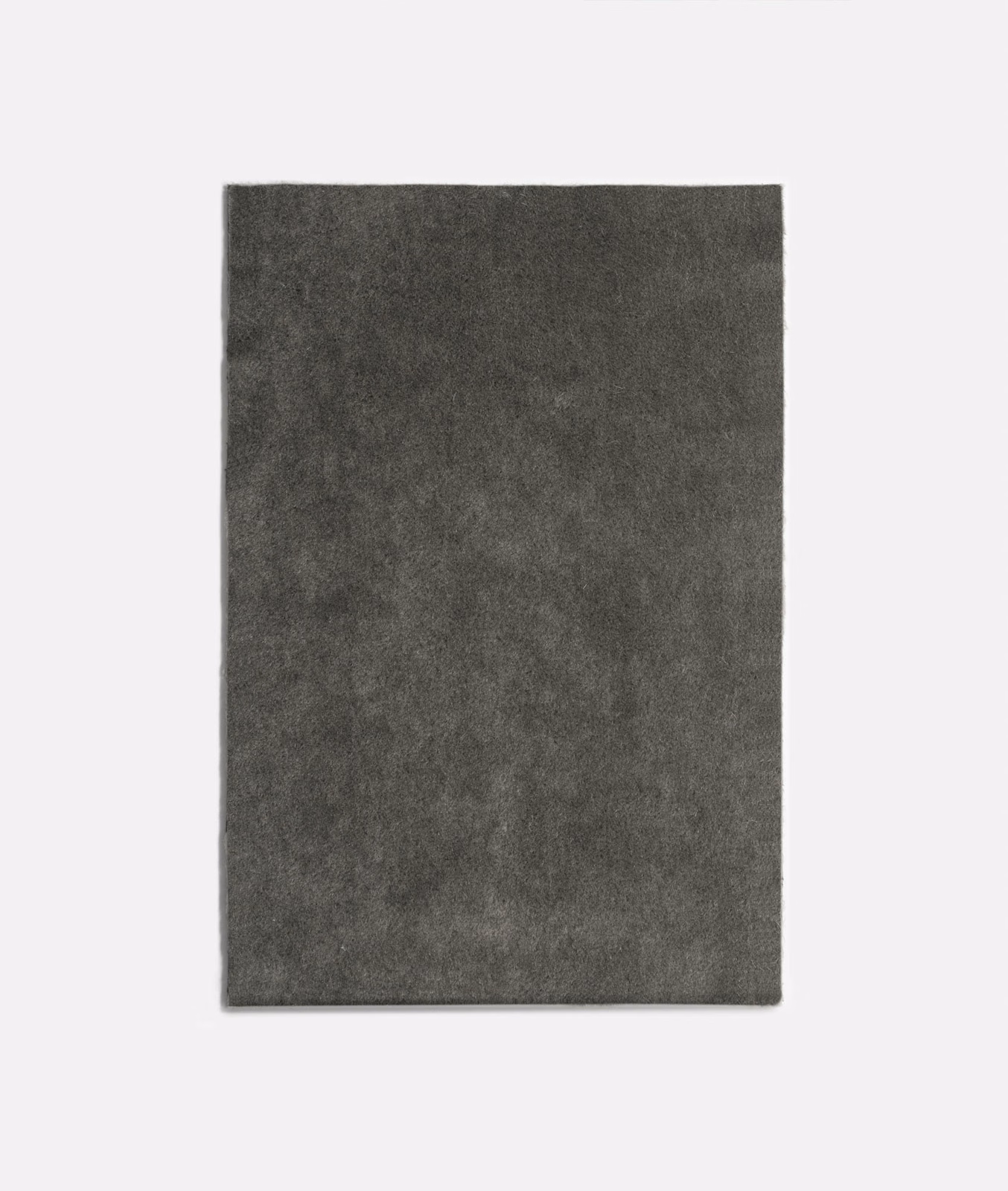Deep charcoal-grey velvet swatch with softly clouded pile and subtle tonal variation