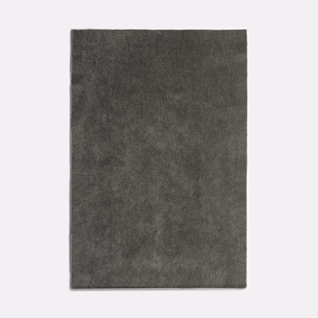 Deep charcoal-grey velvet swatch with softly clouded pile and subtle tonal variation