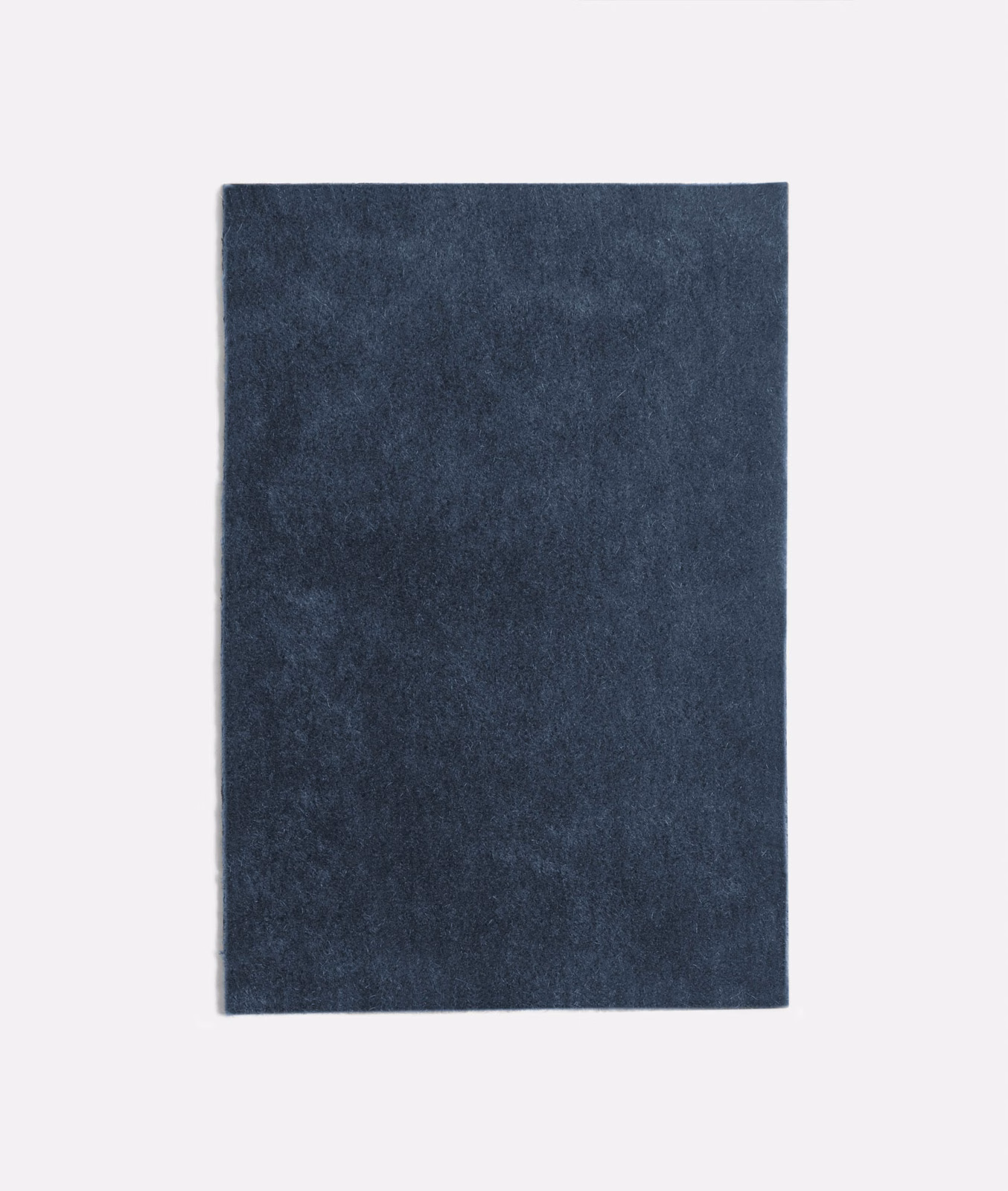 Deep navy velvet swatch with smoky mottling and a softly light-catching pile