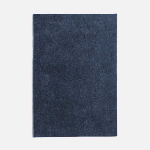 Deep navy velvet swatch with smoky mottling and a softly light-catching pile
