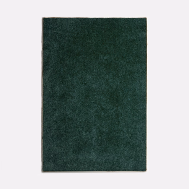 Dark petrol-green velvet swatch with soft nap variation and subtle mottled shading
