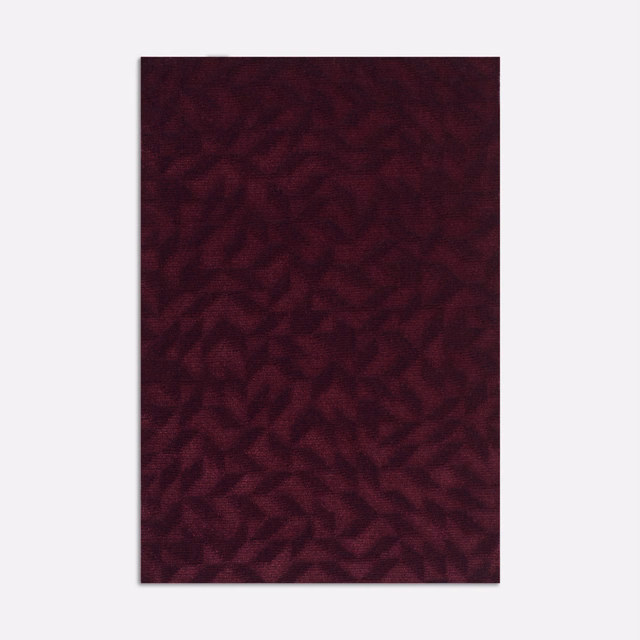 Deep bordeaux velvet with shadowed, irregular organic marks and directional pile