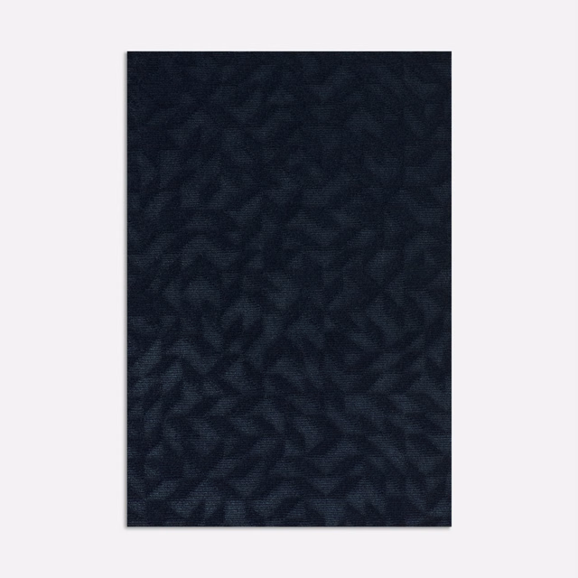 Deep ink-blue velvet swatch with subtle shadowed leaf shapes and low sheen