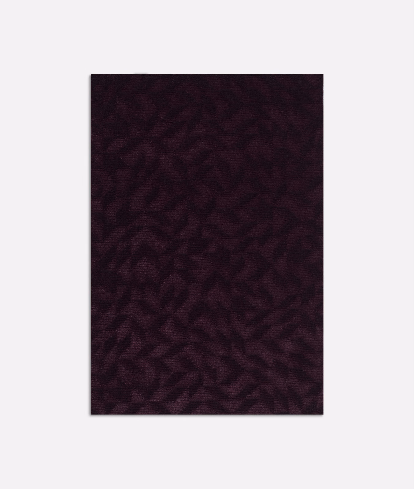 Deep plum velvet swatch with a shadowed, irregular organic pattern and soft pile