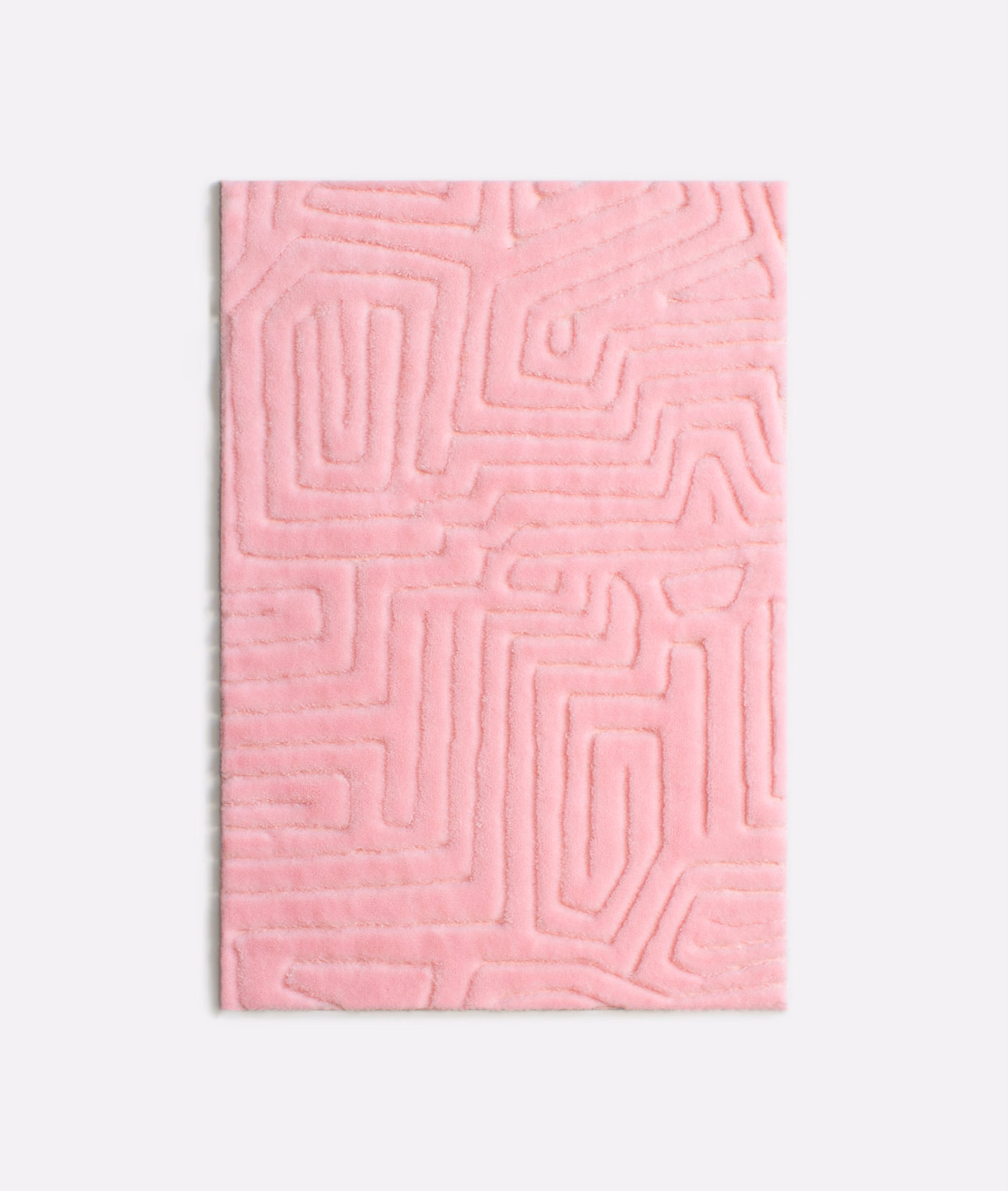 Soft flamingo-pink velvet swatch with raised maze-like linear pattern and plush nap