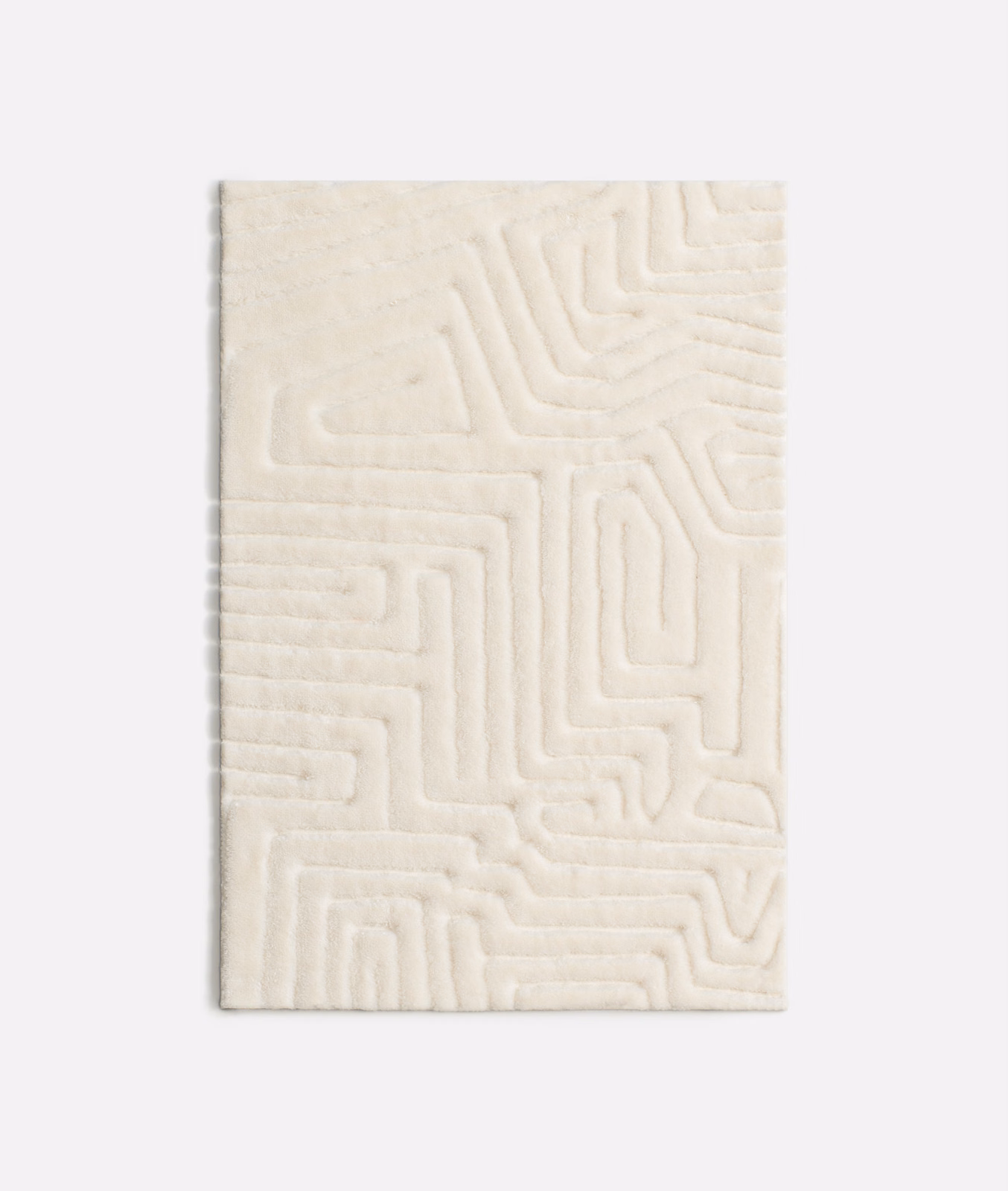 Soft ivory velvet swatch with raised maze-like geometric channels and plush shading