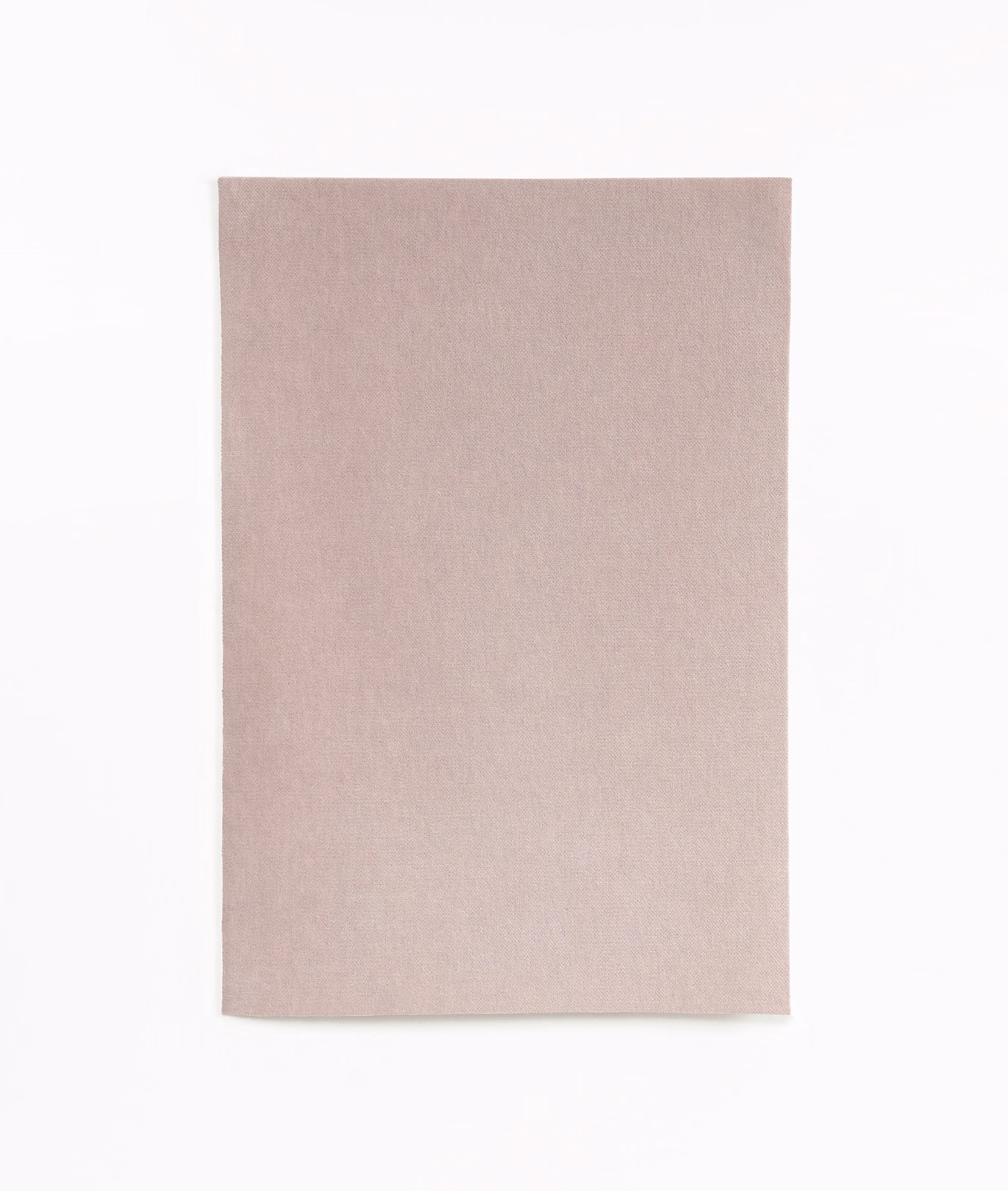 Pale dusty rose velvet swatch with subtle directional nap and soft tonal variation