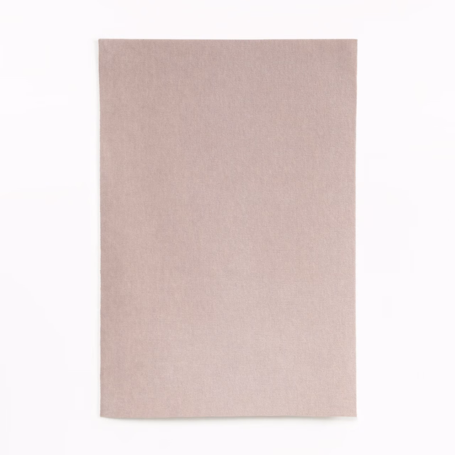 Pale dusty rose velvet swatch with subtle directional nap and soft tonal variation