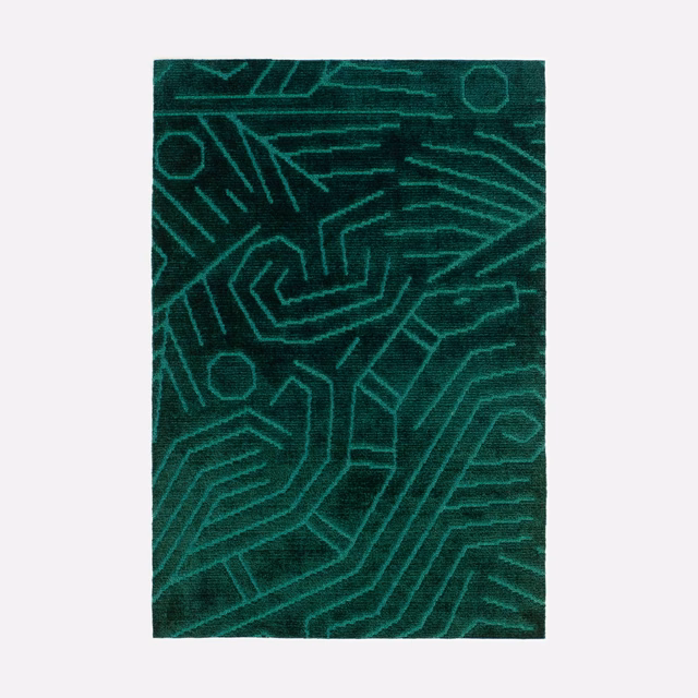 Deep malachite velvet with glowing teal circuit-like geometric lines and plush pile