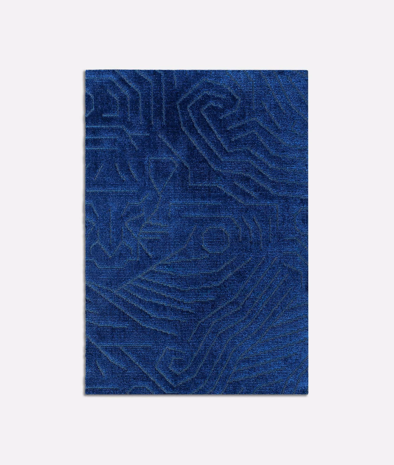 Deep zaffiro blue velvet with raised, meandering geometric lines and soft tonal sheen