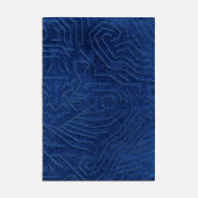 Deep zaffiro blue velvet with raised, meandering geometric lines and soft tonal sheen