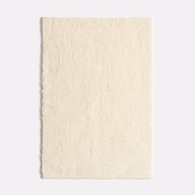 Pale ivory velvet swatch with softly brushed, subtly cloudy vertical pile texture