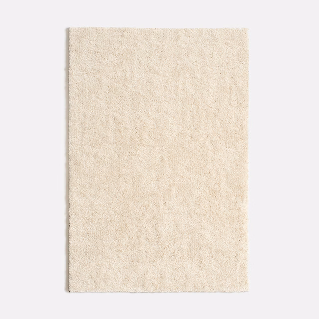 Warm ivory velvet with a short plush pile and subtle cloudy mottling