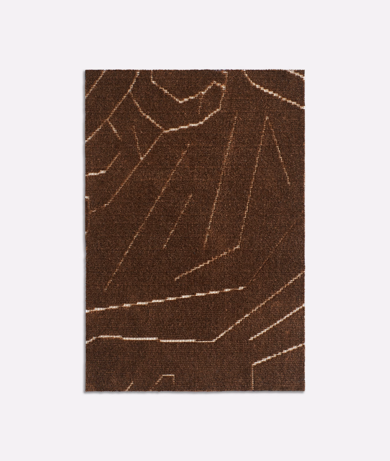 Dark tobacco velvet with pale angular lines and a dense, softly textured surface