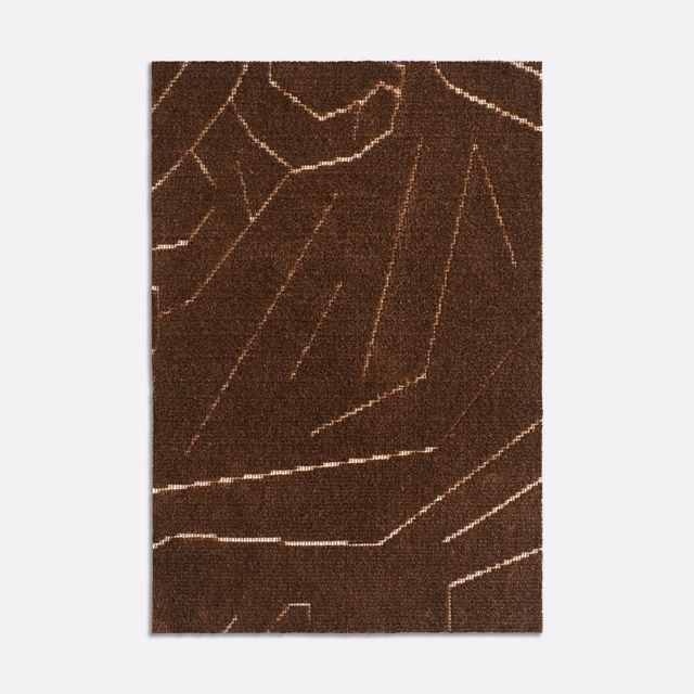 Dark tobacco velvet with pale angular lines and a dense, softly textured surface