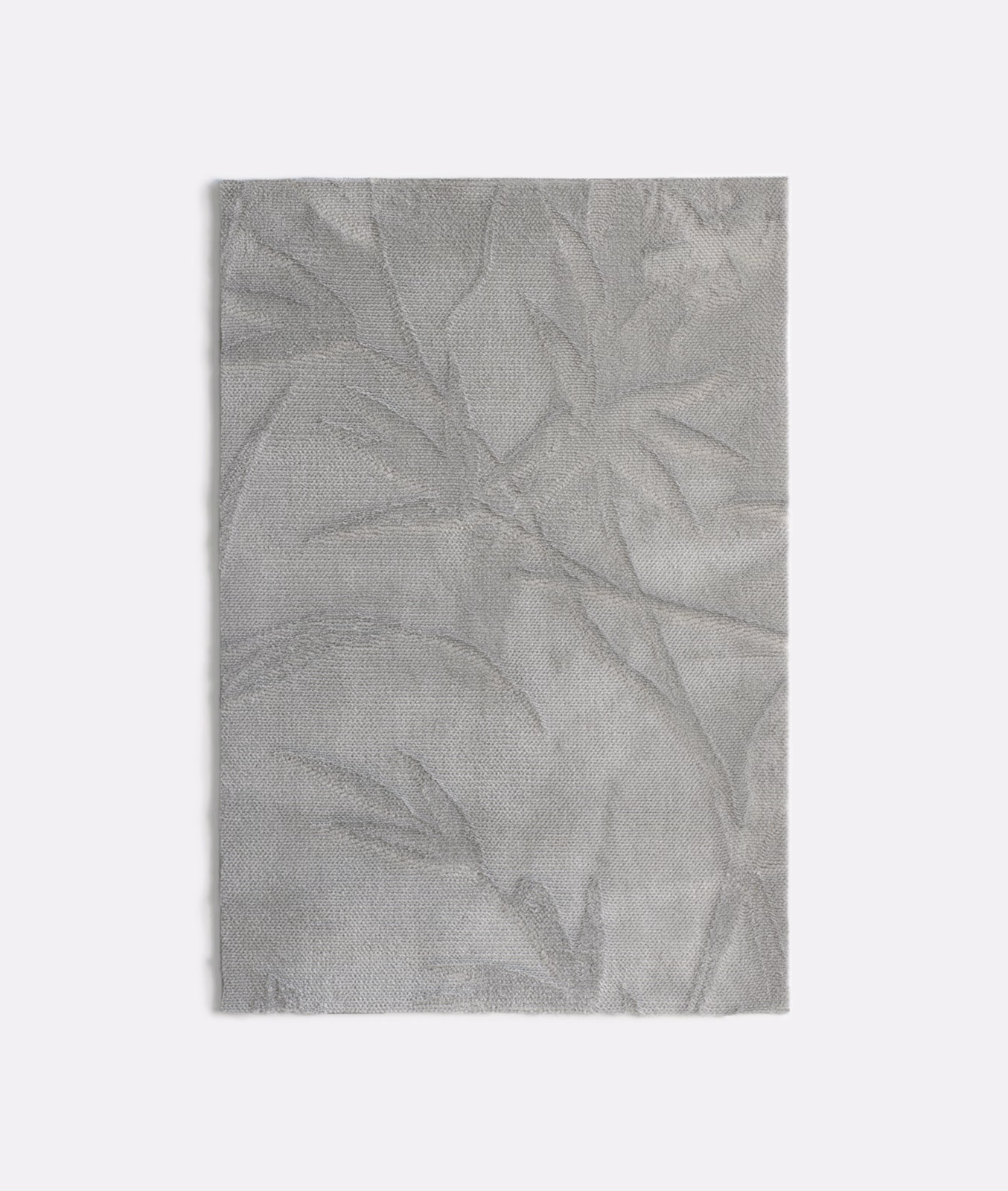 Pale silver-grey velvet with large tonal overlapping leaf forms and a softly textured surface
