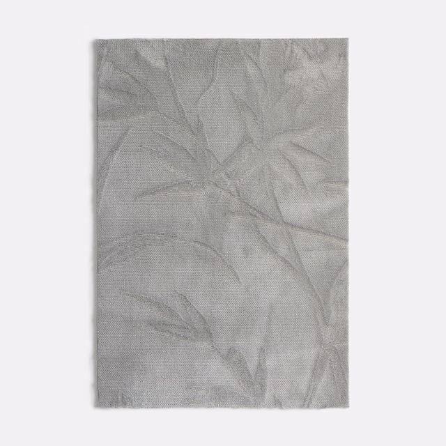 Pale silver-grey velvet with large tonal overlapping leaf forms and a softly textured surface